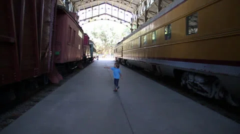 Child keeps an eye on the train gently Stock Footage 22694144