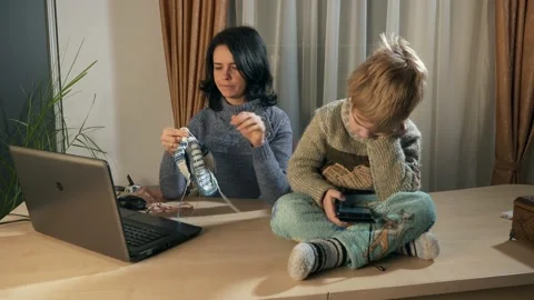 Child Kid Boy Use Watching Smartphone Internet Social Media. Mother Knit 4K Video stock 167819096