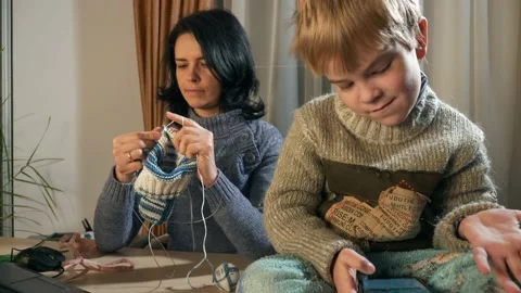 Child Kid Boy Use Watching Smartphone Internet Social Media. Mother Knit 4K Video stock 167819249