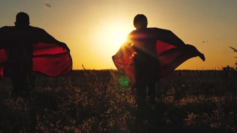 Child kid superheroes running sunset red cloaks, silhouette boy girl playing Stock Footage 266937059