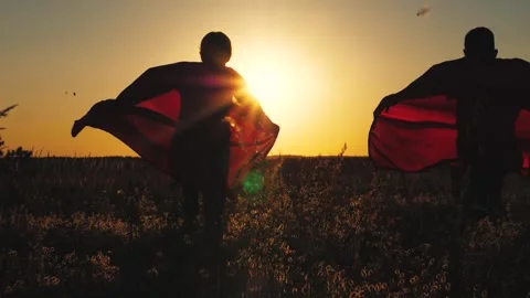 Child kid superheroes running sunset red cloaks, silhouette boy girl playing Stock Footage 269824628