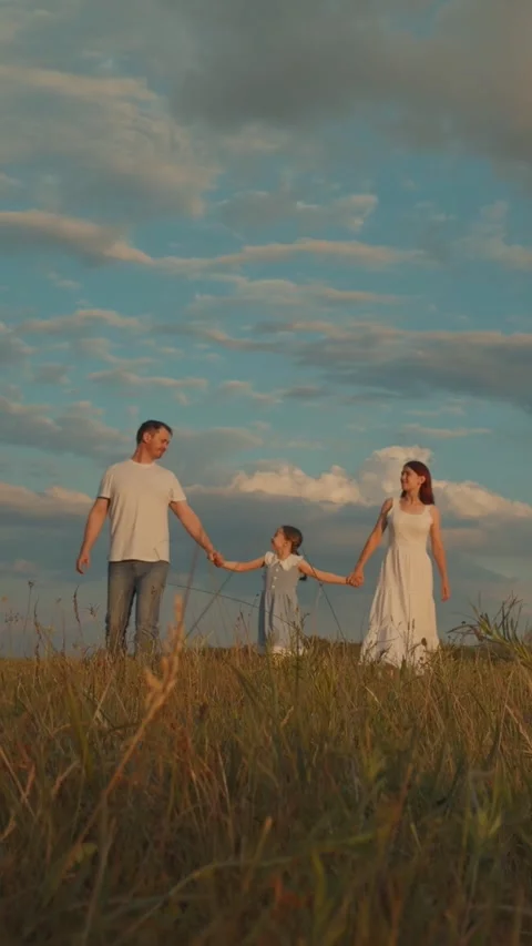 Child kid walking grass holding father mother hand, happy family, family Stock Footage 296708157