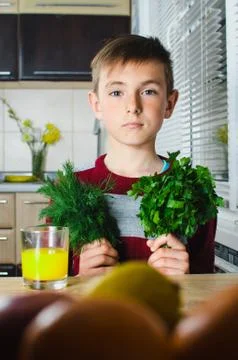 The child in the kitchen with herbs 写真素材