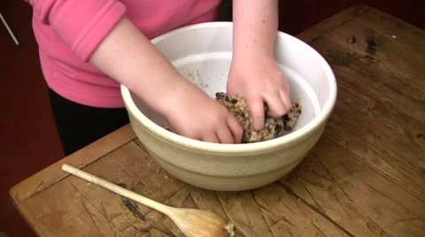 Child kneading cookie dough Stock Footage 52092690