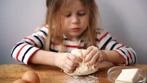 Child kneading dough Video stock 73763215