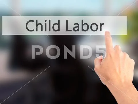 Child Labor - Hand pressing a button on blurred background conce Stock Photos