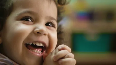 Child laughing and clapping hands Video stock 2257533