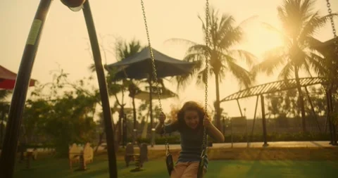 Child laughs and smiles while playing in the city park. Child happy laughing Stock Footage 307734484