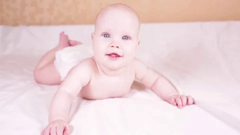     the child laughs. child on a light background. Stock Footage 82716730
