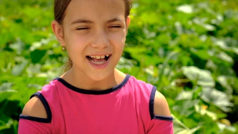 The child laughs in the park. Selective focus. Stock Footage 203975629