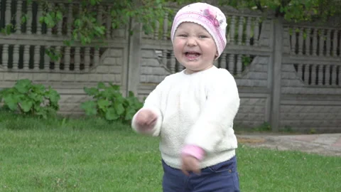 The child laughs in the yard Video stock 261955330