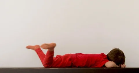 Child laying on table after game Stock Footage 119782082