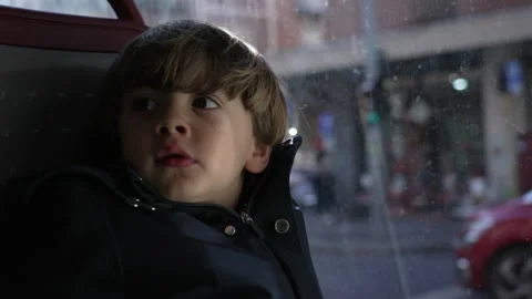 Child leaning on bus window staring at u... | Stock Video | Pond5