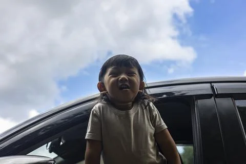 Child Leaning Out Of Window While Car Stop Stock Photos