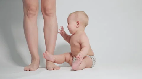 Child learn to stand up, first walking skills Stock Footage 242766122