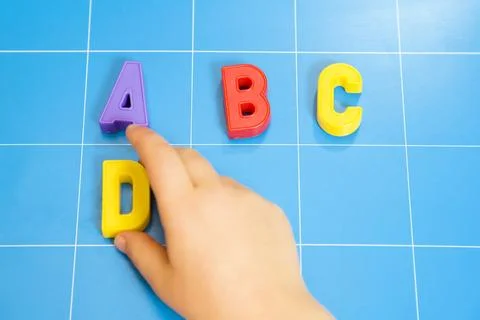 Child learning the ABC's. The focus is on the letter B Stockfoto's