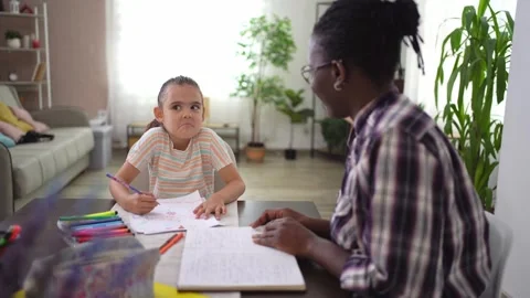 Child learning and interacting with her teacher Stock Footage 315569909