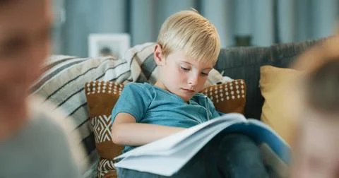 Child, learning and reading book in family home with knowledge, literature .. Stock Photos