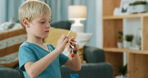 Child, learning and serious with molecular model, growth or knowledge with .. Stock Photos