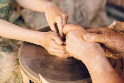 Child learning clay modeling Фото