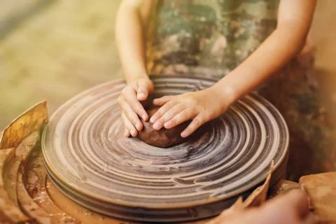 Child learning clay modeling Фото