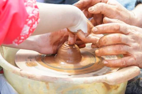 Child learning clay modeling Pottery training Stock Photos