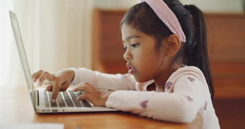 Child learning to count on a laptop at home. little girl working online and Video stock 200926037