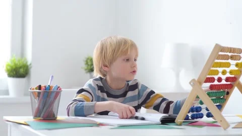 Child learning to count using abacus Video stock 148587674