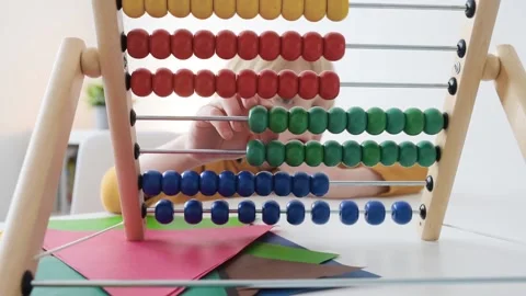 Child learning to count using abacus Video stock 148587701