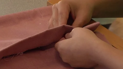  	A child learning how to button in a Montessori School Class 	 Stock Footage 83224627
