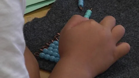  	A child learning how to count in a Montessori School Class 	 Stock Footage 83224826