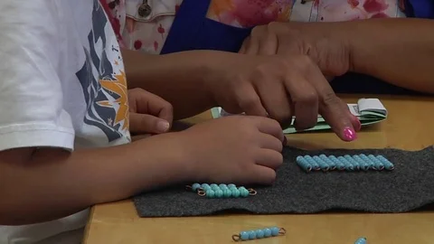 A child learning how to count in a Montessori School Class  Stock Footage 83224883