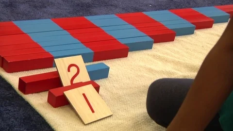 A child learning how to count in a Montessori School Class  Stock Footage 83225103