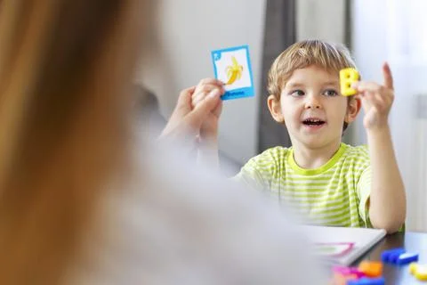 Child learning letters with flashcards Stock Photos