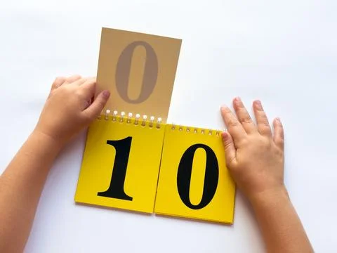 Child learning numbers with educational flashcards on white background Foto stock