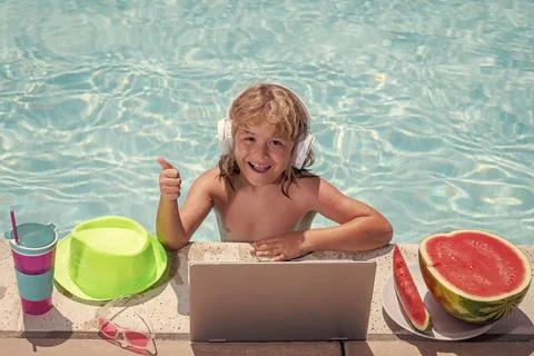 Child learning online computer laptop. Child relax and rest on colorful Foto stock