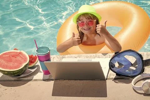 Child learning online computer laptop. Child relax and rest on colorful 写真素材