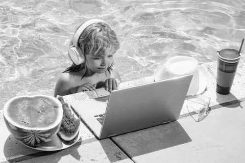 Child learning online computer laptop. Child relax and rest on colorful 写真素材