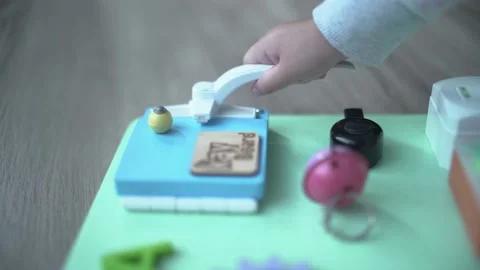 Child learning to open or close a door knob with montessori method Stock Footage 158951133