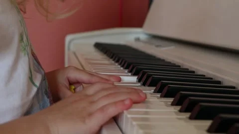 Child learning to play the piano. Video stock 244877851