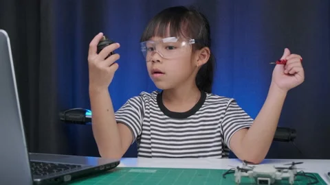 Child learning repairing getting lesson control toy drone. STEM education Stock Footage 237499272