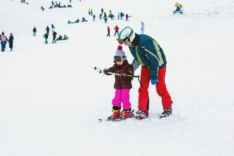 The child learning to ski and man on the slope in Bansko, Bulgaria Stock Photos