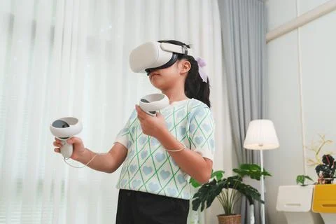 Child learning through interactive gaming and simulation. VR for edutainment. Stock Photos