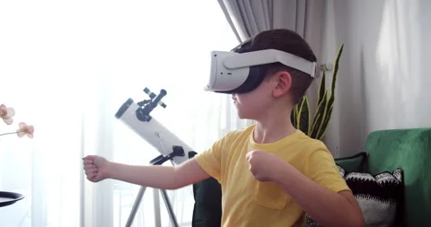 Child learning using virtual reality headset. Education child in virtual reality Stock Footage 262974289