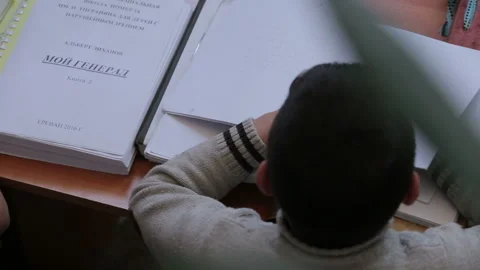 A child learns and writes braille at school 11 Stock Footage 268283420