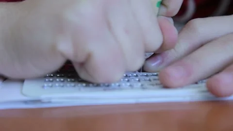 A child learns and writes braille at school 4 Stock Footage 268283629