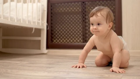 Child learns to crawl on floor in the childrens room 스톡 동영상 87182875