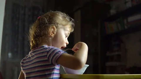 The child learns to eat Stock Footage 81889719
