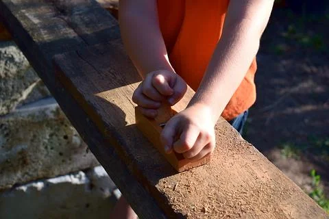 The child learns to plan the plane. Stock Photos