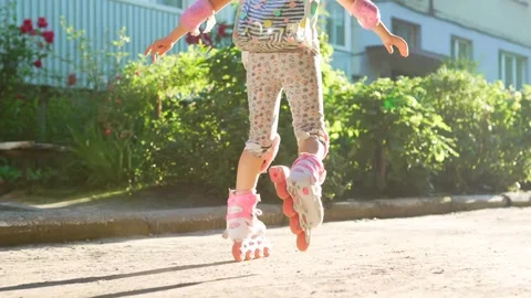 Child learns to ride on roller skates.Summer activities for children. Stock Footage 277719296